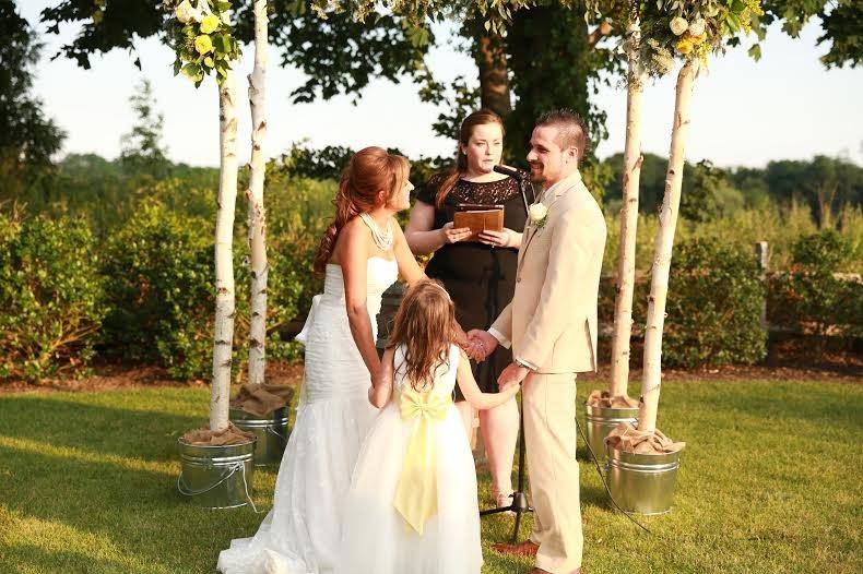 Toni, Anthony & Madelynn share a laugh during their ceremony at Sherwood Tasting Room*Photo courtesy of Danielle Simmons Photography