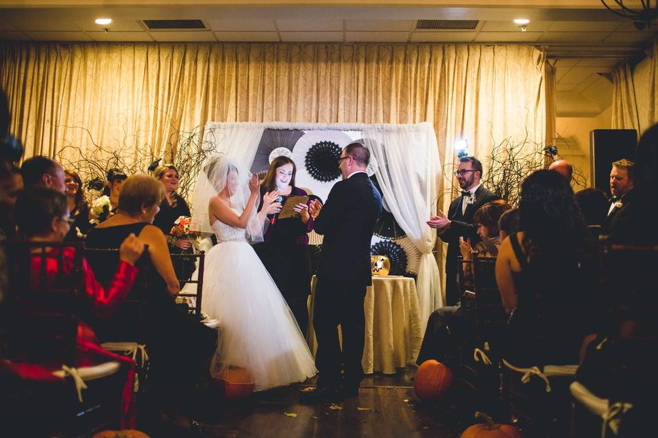 Jackie & Craig celebrate the breaking of the glass at the conclusion of their Halloween themed ceremony at the Three Village Inn*Photo Courtesy of JAYLim Studios