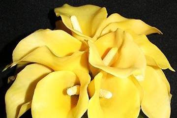 A petite bridal bouquet of sunny yellow, faux calla lilies.