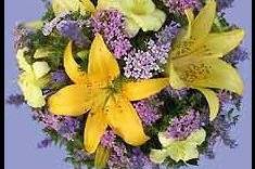 Fresh bridal bouquet accented with sunny yellow Asian lilies.