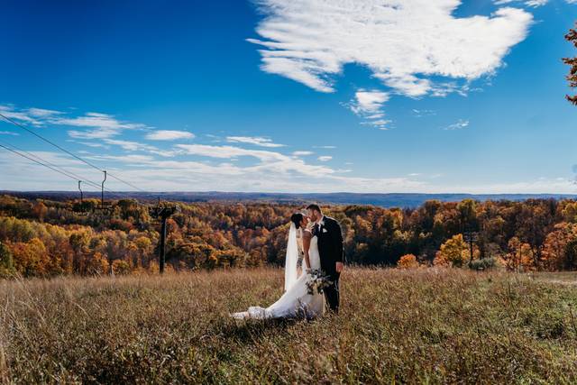 Couple on top of ski hill