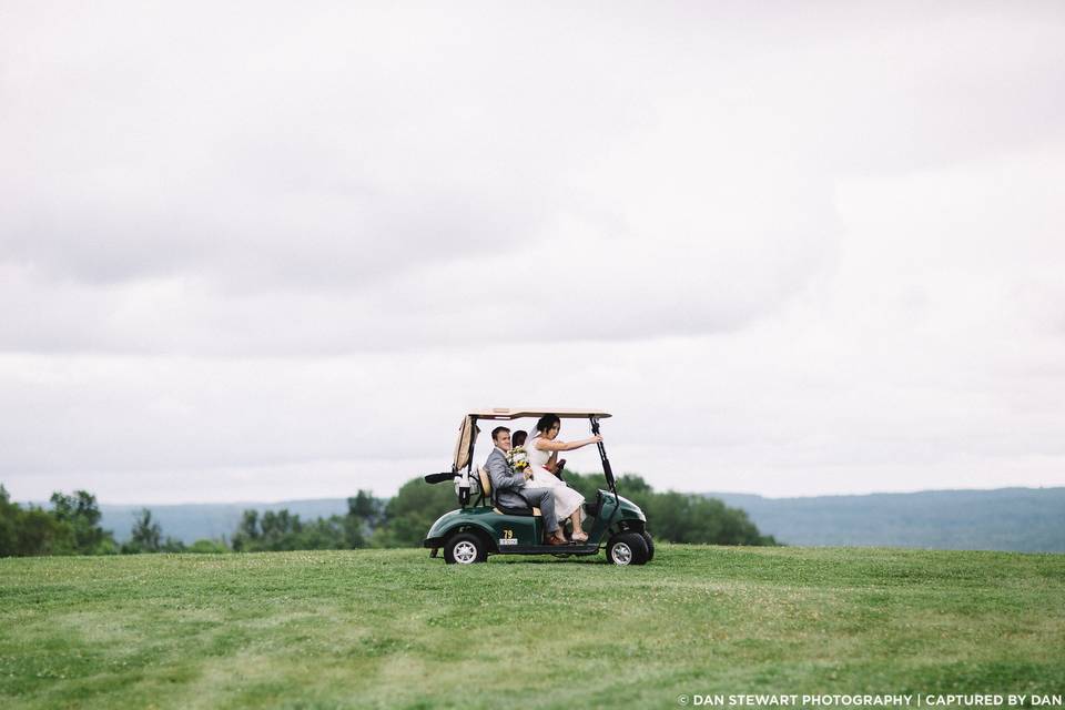 Couple on golf cart