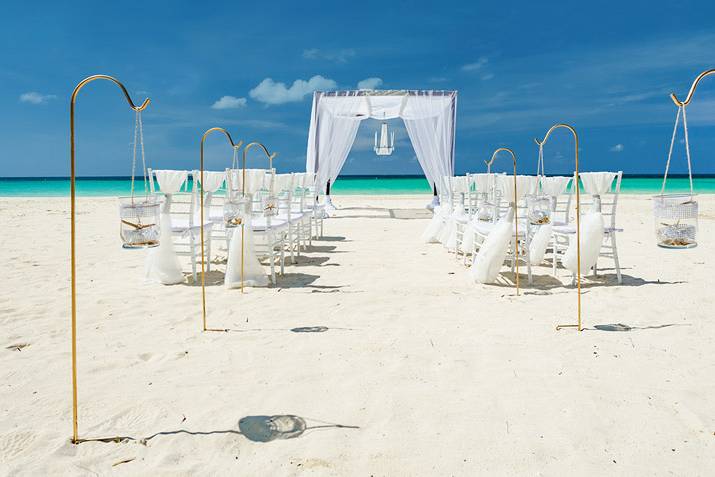 White chandelier beach wedding