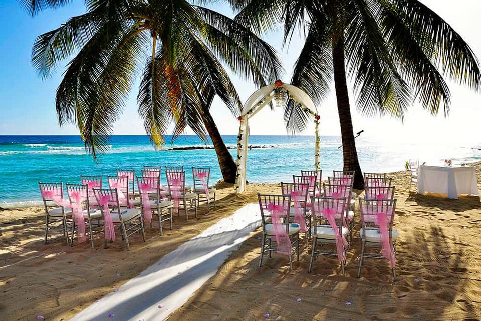 Pink beach sunset wedding