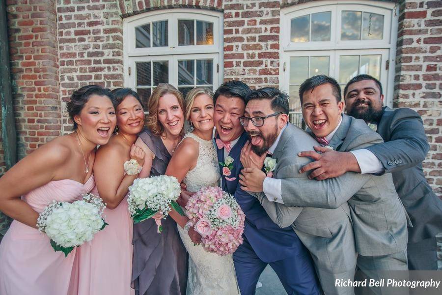 The couple with the bridesmaids and groomsmen