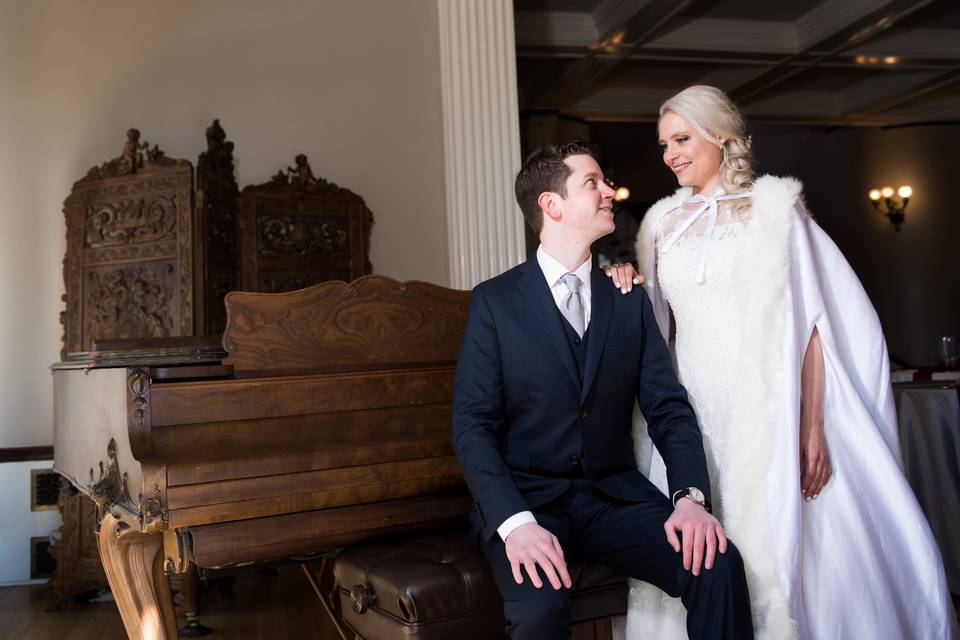 Couple posing under archway