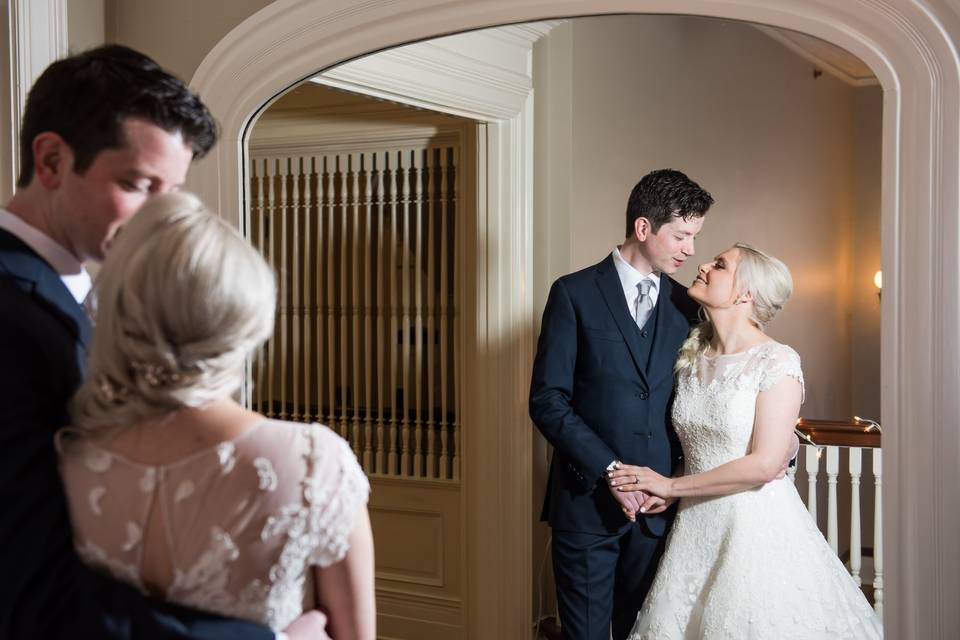 Groom posing in elegant room