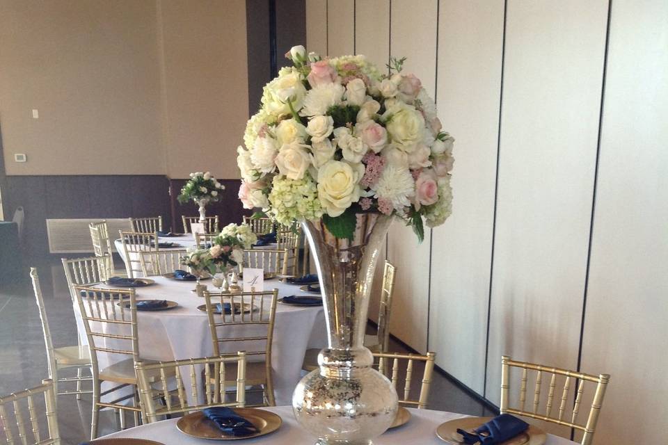 Table decor with centerpieces, chargers and special chairs