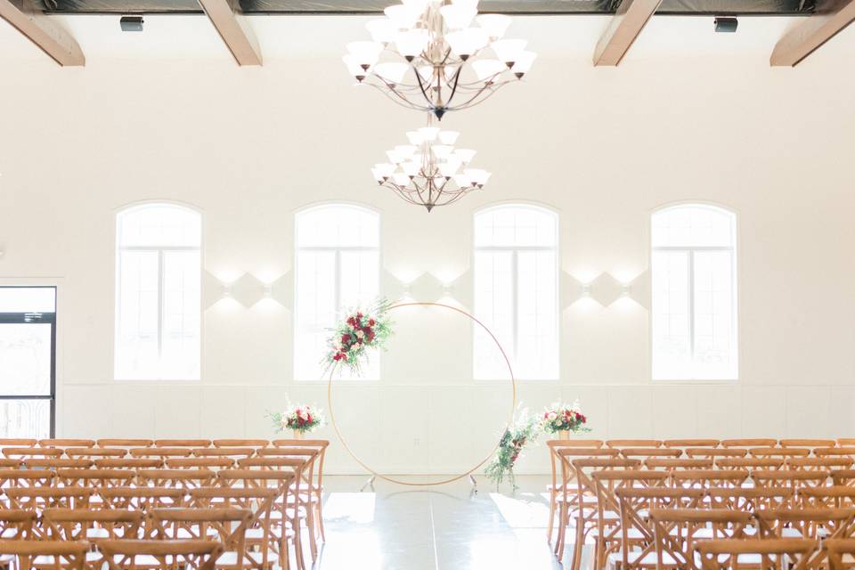 Indoor ceremony with arch