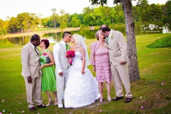Great wedding photography idea...both sets of parents and bride and groom sharing a smooch!