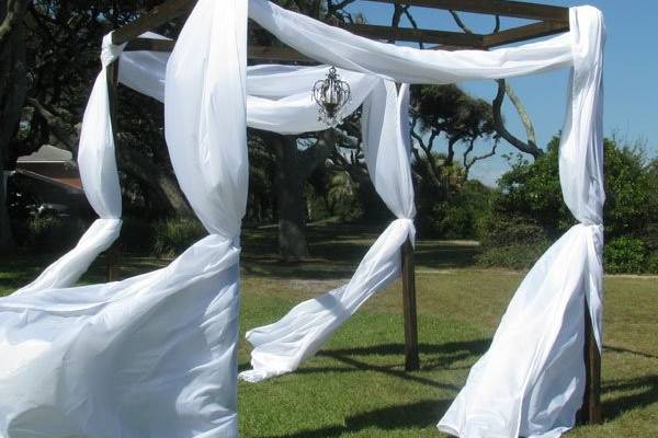 Our elegant Chuppah and Bronze and Crystal Pendant Chandelier are an avant-garde addition to any oceanside ceremony