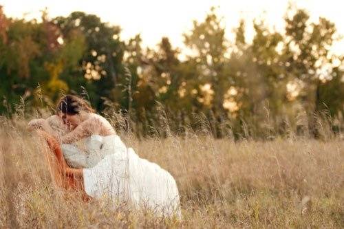 Bride and Groom Private Moment in Field with Chair