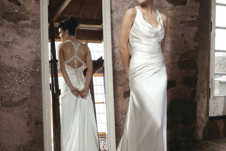 Style #3703
Cowl draped charmeuse tank top with asymmetrical draping on bodice, slimskirt with gores, crystal and pearl beaded racerback accents a deep back neckline with a chapel length train.