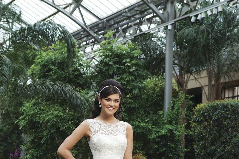 Style #3730
A lace and tulle sheer Sabrina neckline and a chiffon cummerbund, complement the chiffon A-line skirt, that is accented with beaded lace appliqués. This style has a V-back and fabric buttons that cover the back zipper and a chapel length train.