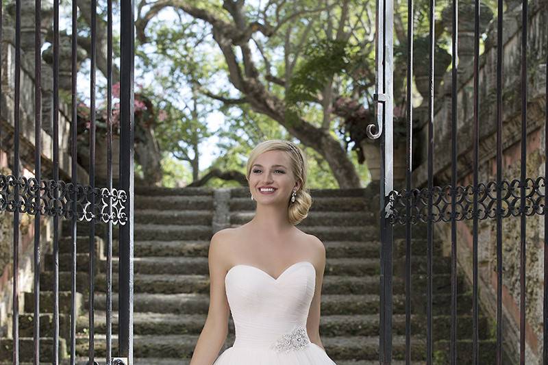 Style 3890 <br> Ruched tulle sweetheart neckline, detachable tulle belt with beaded motif, full tulle skirt and horsehair hemmed layers make this pastel ball gown perfect for the fun and romantic bride.
