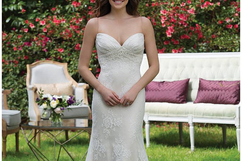 3940 <br>Sweep him off his feet in this allover lace fit and flare gown featuring a corded lace empire waistband, V-back, Charmeuse lining, and sweep train.