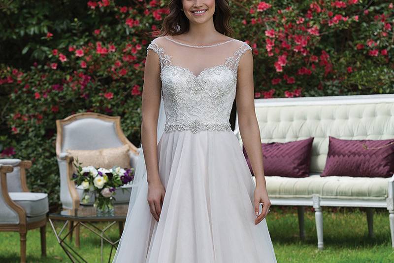 3943 <br> Achieve your dreams of looking like a princess in this beaded lace A-line gown with a Sabrina neckline, natural waist accented with beaded trim, scoop back, and chapel length train. Complete the look with the addition of veil style 3943V.