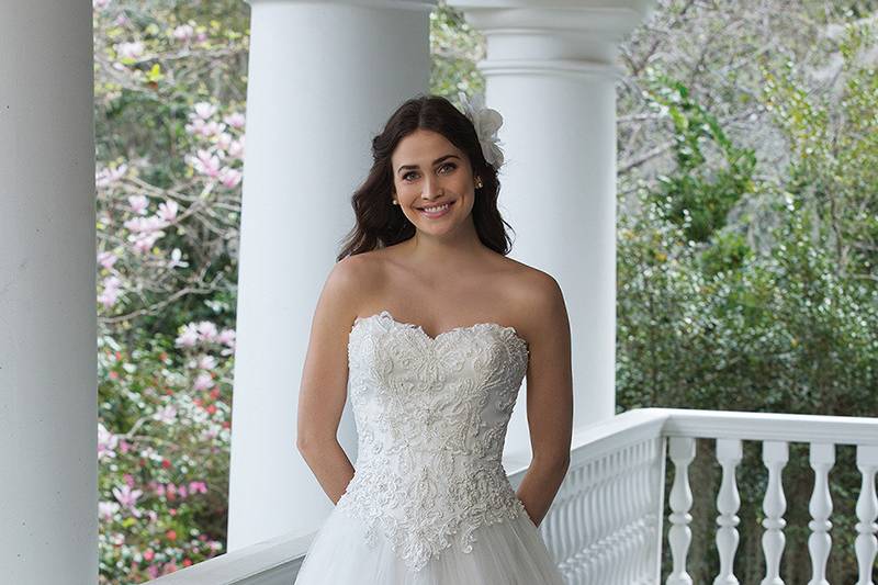 3953 <br> Resemble Cinderella in this tulle ball gown with a sweetheart neckline, beaded lace appliques, full tulle skirt, and chapel length train. Gown shown with a lace up back, also available with a zipper closure as style 3953Z.