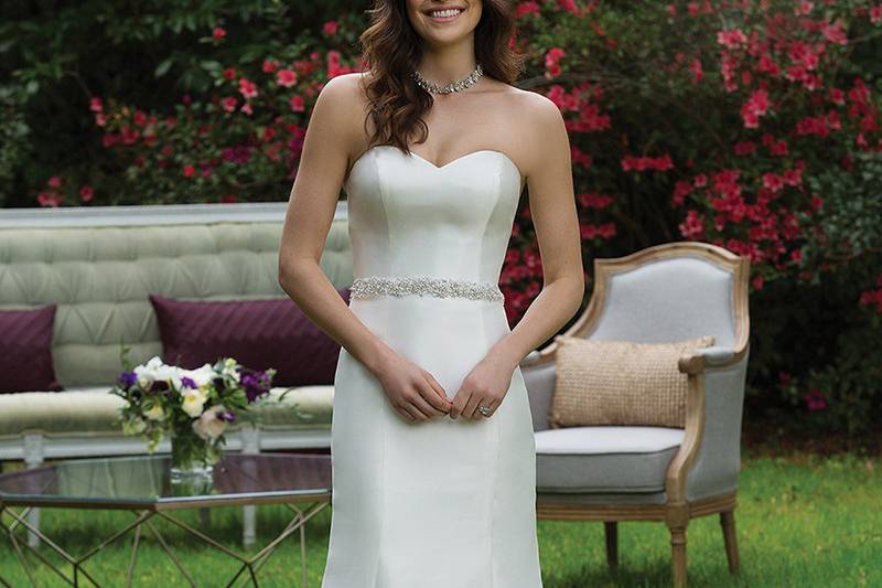 3958 <br> Less is more when it comes to this Mikado fit and flare gown with a sweetheart neckline, natural waistline, and inverted pleats that create the chapel length train.