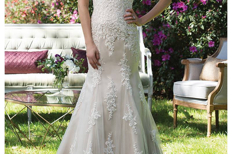 3962 <br> This tulle and satin fit and flare gown is all about the keyhole back! The Queen Anne neckline with heavily adorned bodice and finished hem lace complete this beauty.