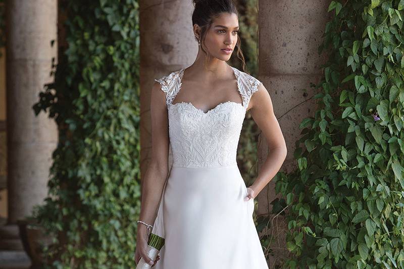 Sincerity Bridal	4001	<br>	Feel graceful in this Satin Queen Anne neckline accented by embroidered lace, illusion straps, and a romantic keyhole back. The A-line Satin skirt offers hidden pockets and buttons that cascade from the zipper to the hem of the gown.