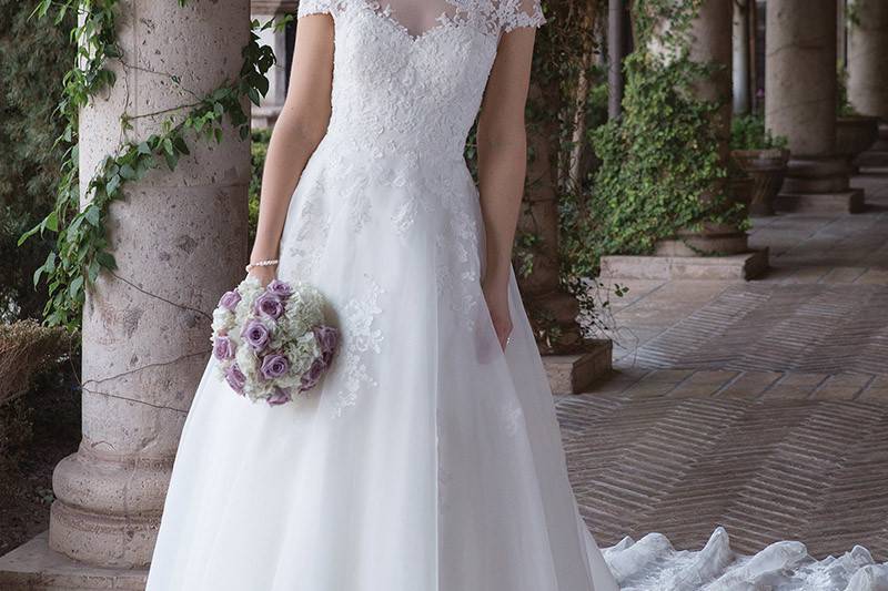 Sincerity Bridal	4012	<br>	Feel like Cinderella in this sweetheart illusion off the shoulder A-line gown. Corded lace accents the organza skirt. A detachable cathedral train creates the fairy tale with Illusion and lace to end of the train. Buttons finish the illusion back to the covered zipper.
