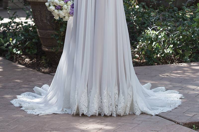 Sincerity Bridal	4030	<br>	Comfort is key in this traditional Chiffon gown. An illusion off the shoulder neckline is framed with embroidered lace. A scoop Illusion back with button closures completes the romance.