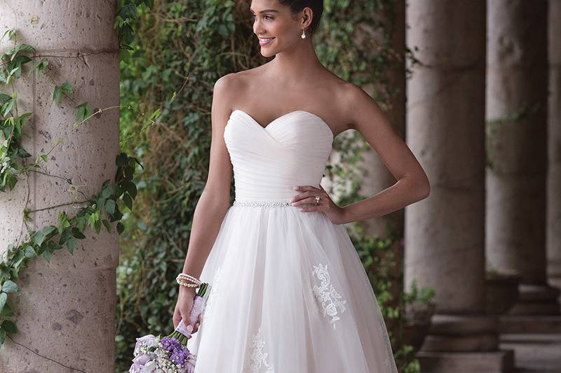 Sincerity Bridal	4036	<br>	Romance is defined in this tulle ball gown. The gown is lined in Charmeuse to feel as good as you look. A pleated tulle bodice is accented with a thin hand beaded belt. Soft lace accents float down the skirt of the gown to the finished hem lace.
