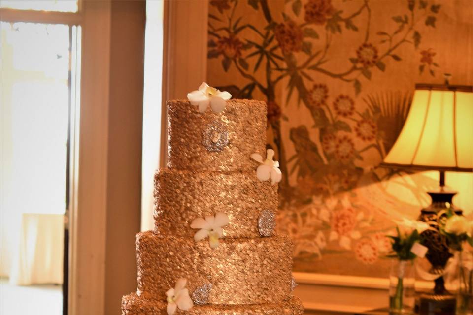 Tall wedding cake with gold bits