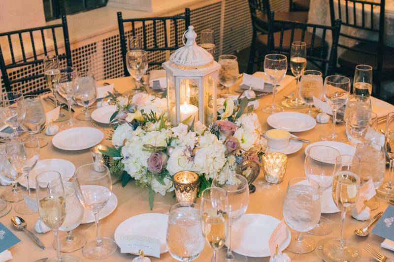 Photo courtesy of Zev Fisher PhotographyLantern surrounded by lush flowers and lots of texture