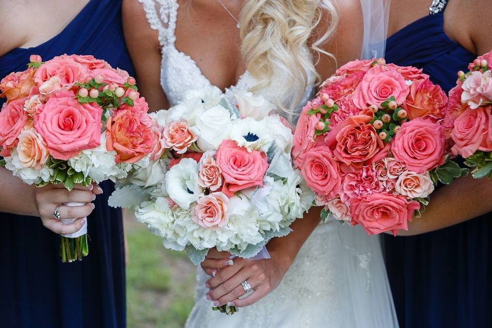 Bridesmaid bouquet using coral roses and mix flowersFlowers by Exotica the signature of flowers Photos by C. Baron PhotographyVenue at Crystal Springs