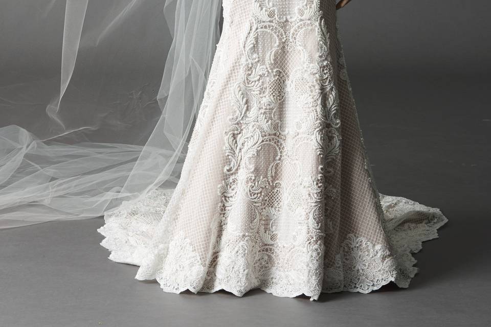 Style 7040B Madalyn <br> Slip into this simple and romantic Baroque Lace gown with a sweetheart neckline and contrast lining. Puddle Train.