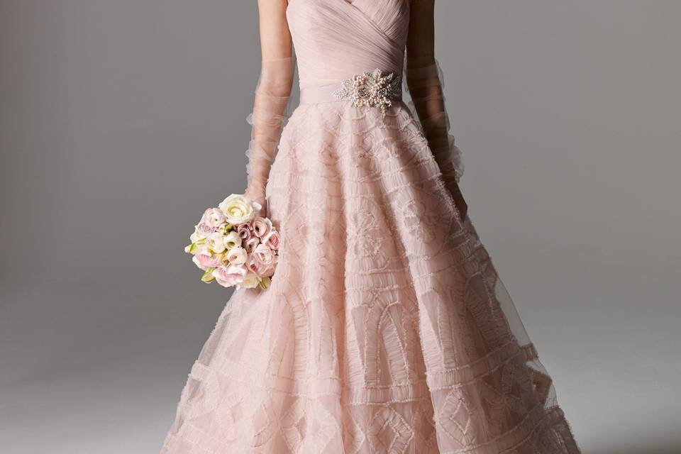 Style 8061B Murphy <br> Pretty in pink, this fit and flare gown in Soft Netting features a sweetheart neckline, symmetrical rouching around the bodice and a soft, flowing skirt. Shown with Lithia Belt style 8904 (sold separately). Sweep Train.