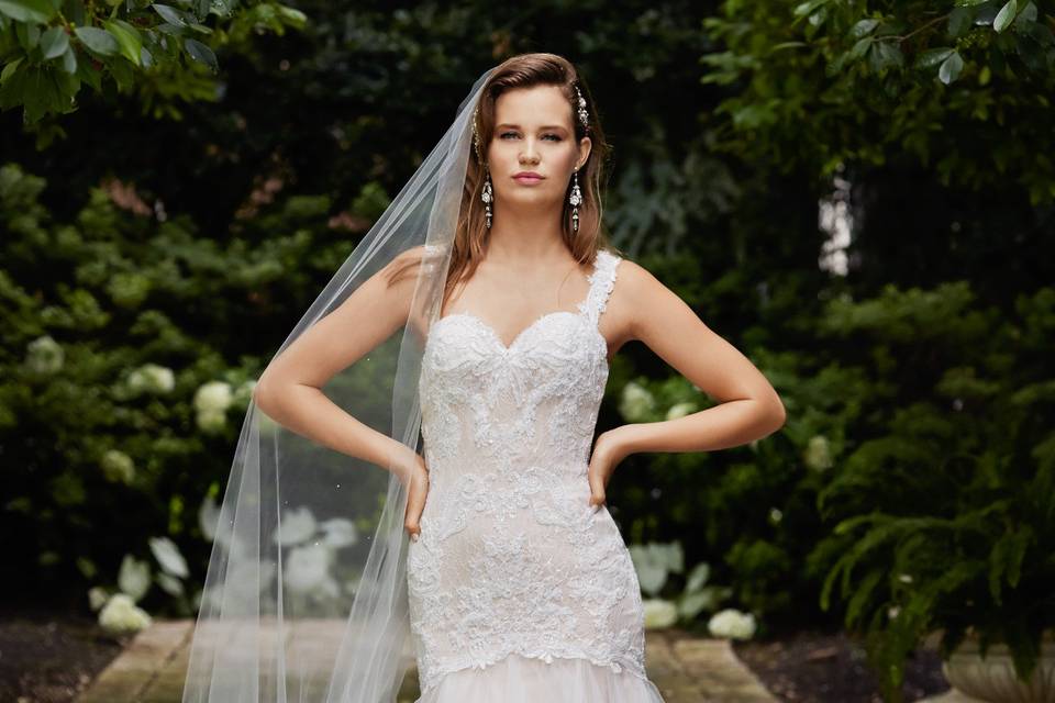 Style 14523 Nadine <br> This strapless ballgown with three-dimensional flowers, dotted netting, and shimmer taffeta waistband exude romance and femininty. Chapel train.