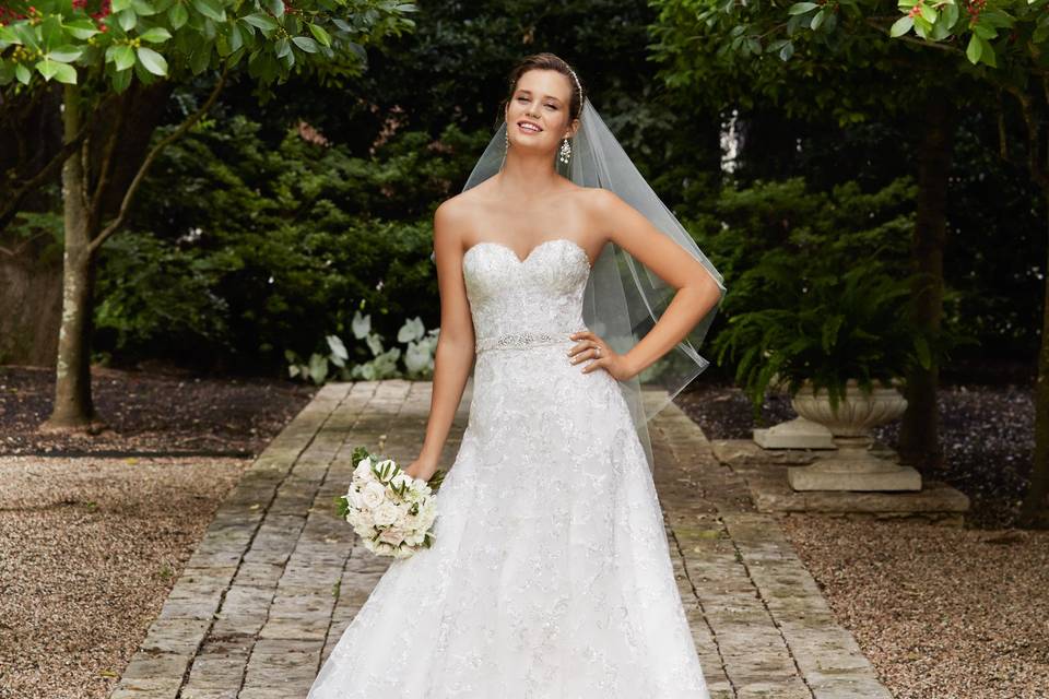 Style 14700 Giselle <br> Bold and glamourous, this fit and flare gown makes a statement with beaded motifs on chantilly lace, a shimmer tulle skirt and a low sexy illusion back. Chapel train.