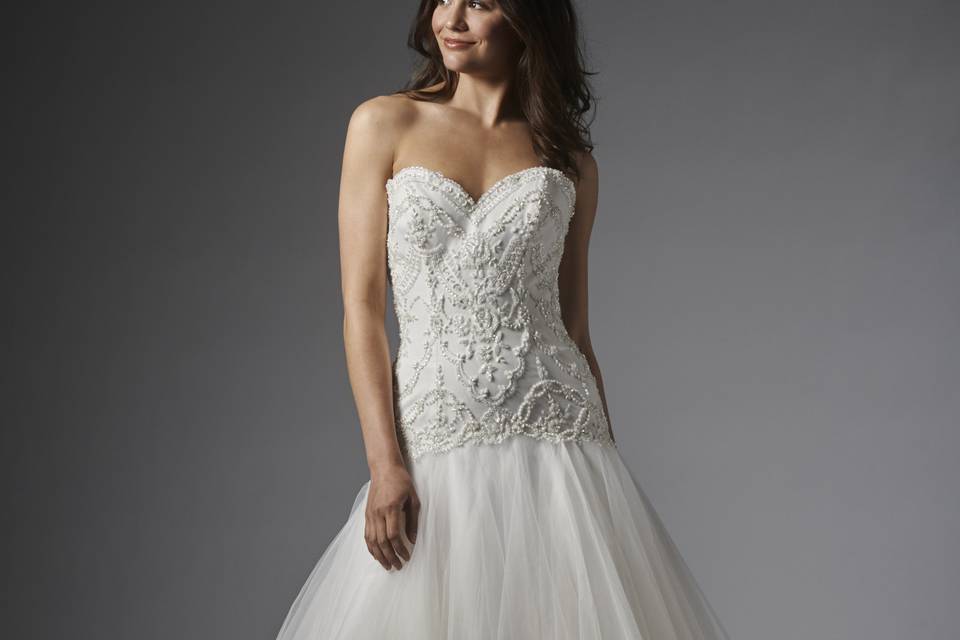 Style 15176 Carla <br> Halter style, fit and flare gown with beaded lace motifs for a touch of sparkle and a beautiful key hole back. The satin lining provides a great fit for every body shape making this an instant classic. Chapel train.
