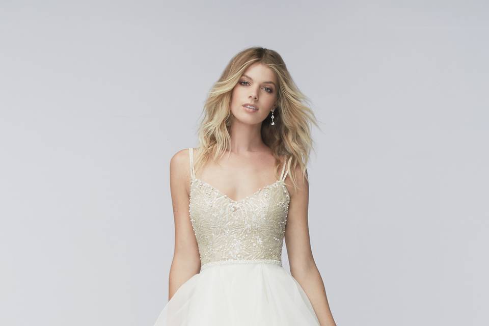 Style 15754 Cheryl <br> This tulle ball gown has a touch of drama with multi-layers cascading from the top of the skirt. This gown features a strapless, sweetheart neckline, lace motifs on the bodice and a slight drop waist. Sweep train.