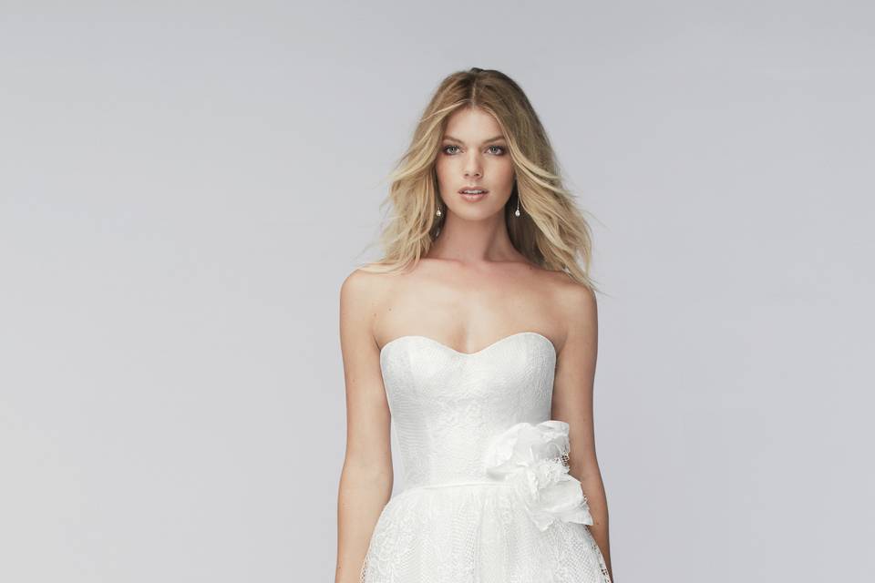 Style 15778 Chloe <br> Exquisite A-line gown featuring bold beading with Swarovski crystals on Lucia Embroidered Motif. This strapless gown shown in Moonlight for a touch of color and drama, features a sweetheart neckline, drop waist and beading trickling down the skirt. Chapel train.