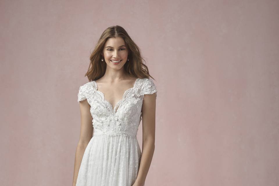 54708 Wren <br>	Romantic Laurel Border lace shapes the body on this figure hugging fit and flare with a sweetheart neckline, spaghetti straps and sheer skirt. Sweep train. Also available with lined skirt as style 54708S.