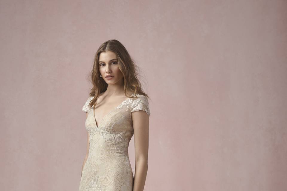55106 Scarlet <br> Channeling the legacy and romance of Jane Austen, this gown of alencon and chantilly lace features a keyhole back and floral details at the waist. Sweep train.