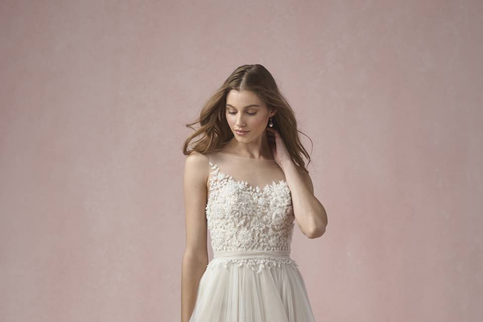 55519 Florence <br> A stunning example of effortless grace, this gown features a beaded motif on the bodice and a flowing silk mousseline skirt with flirty pickups. Chapel train.