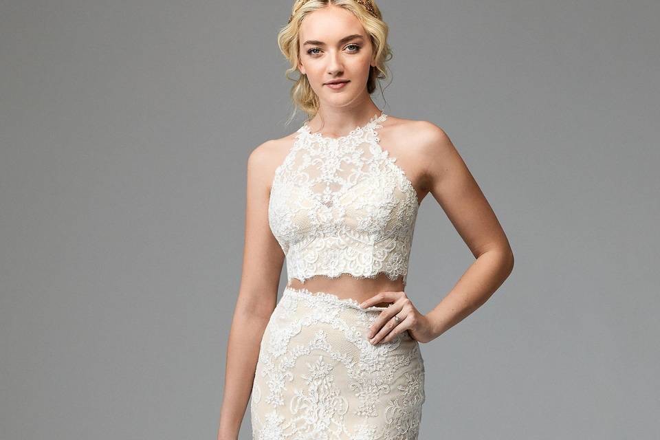 Doyle 57110	<br>	This dress was designed for the whimsical romantic. Doyle's Tillie Chantilly Lace plays backdrop to its dramatic Wildfell Floral Motifs. The front of this fit-and-flare gown features a flattering V-neckline, which is mirrored by a dramatic plunge in the back. Sweep Train.