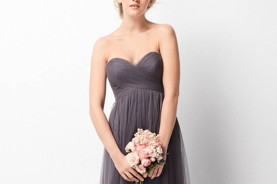 209	<br>	Be the envy of bridesmaids everywhere in this stylish halter dress made of Inna Chiffon. A high-low hem allows her to show off her favorite shoes, while the high-neckline can be opened or closed to fit her taste. A tie at the waist is a perfect finish to the look.