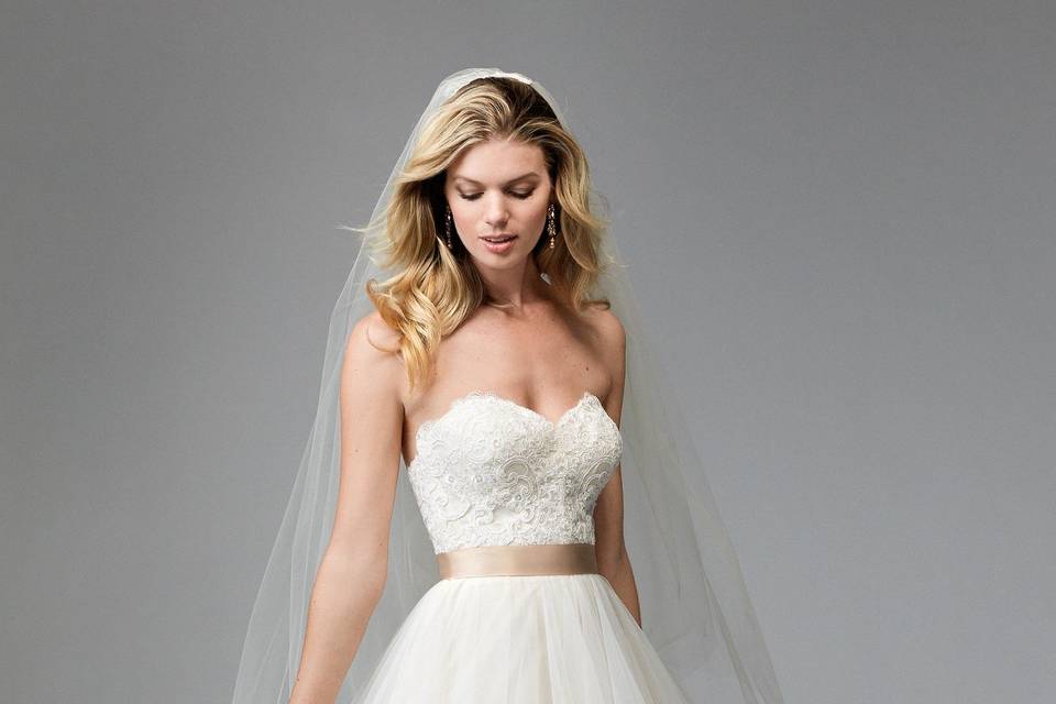 Lou 17229	<br>	This gown was made for movement. Our Lou gown is made of Stretch Satin and features a clean and classic sweetheart, strapless neckline. Dramatic ruffles on the back of the skirt add a flirty touch. Sweep Train.