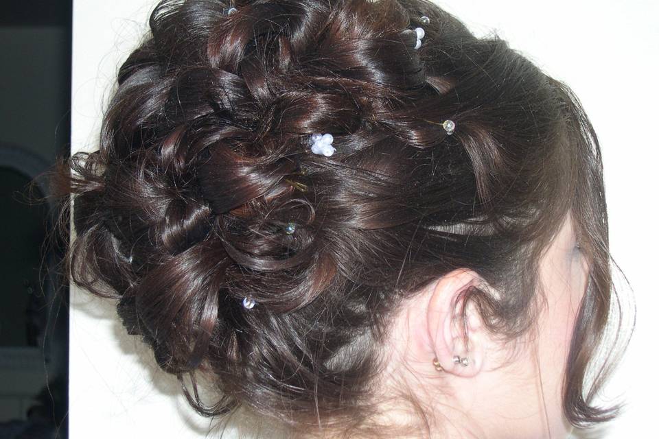 Intricate updo with hair pieces