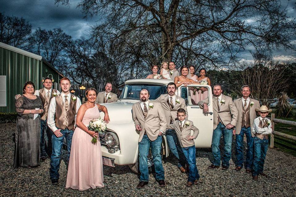 The couple with the bridesmaids and groomsmen