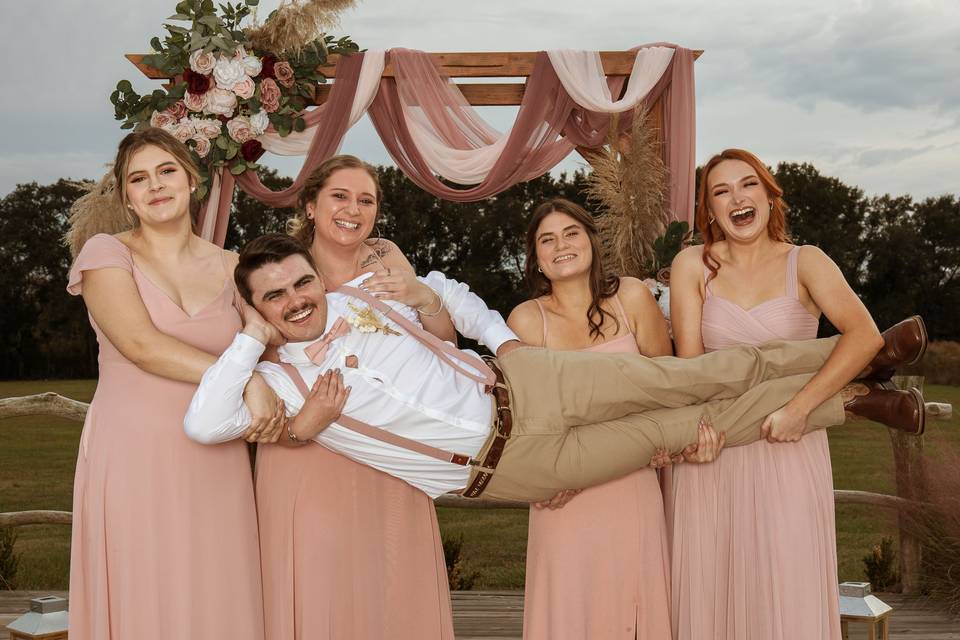 Groom with bridesmaids