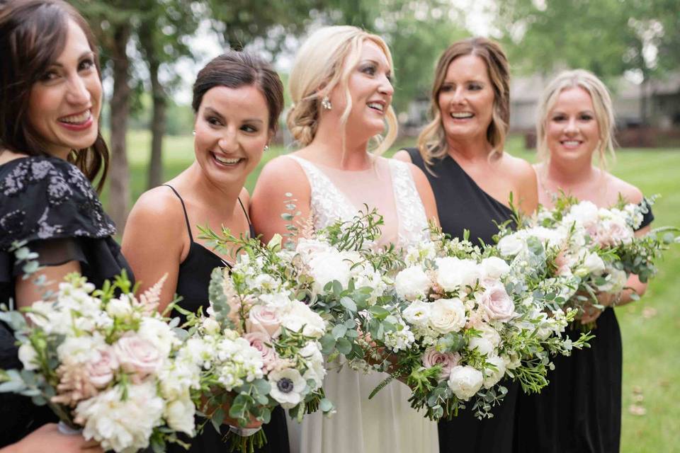 Wedding party holding flowers