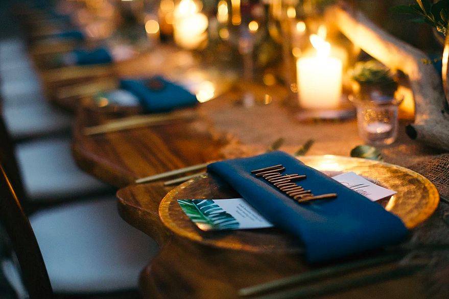 Golden flatware, wood cut names and beautiful menus on each place sitting