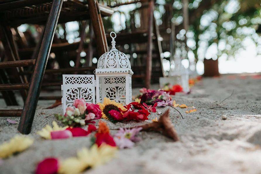 Beach wedding ceremony details with flowers decorations